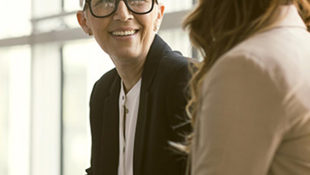 mature woman smiling at a friend