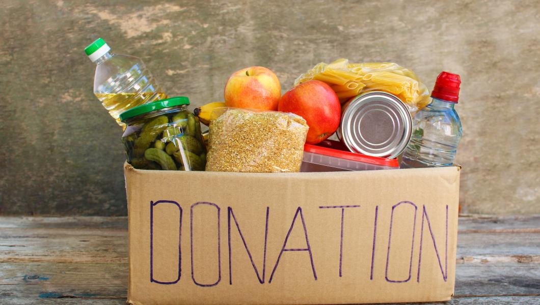 box full of food items labeled for donation