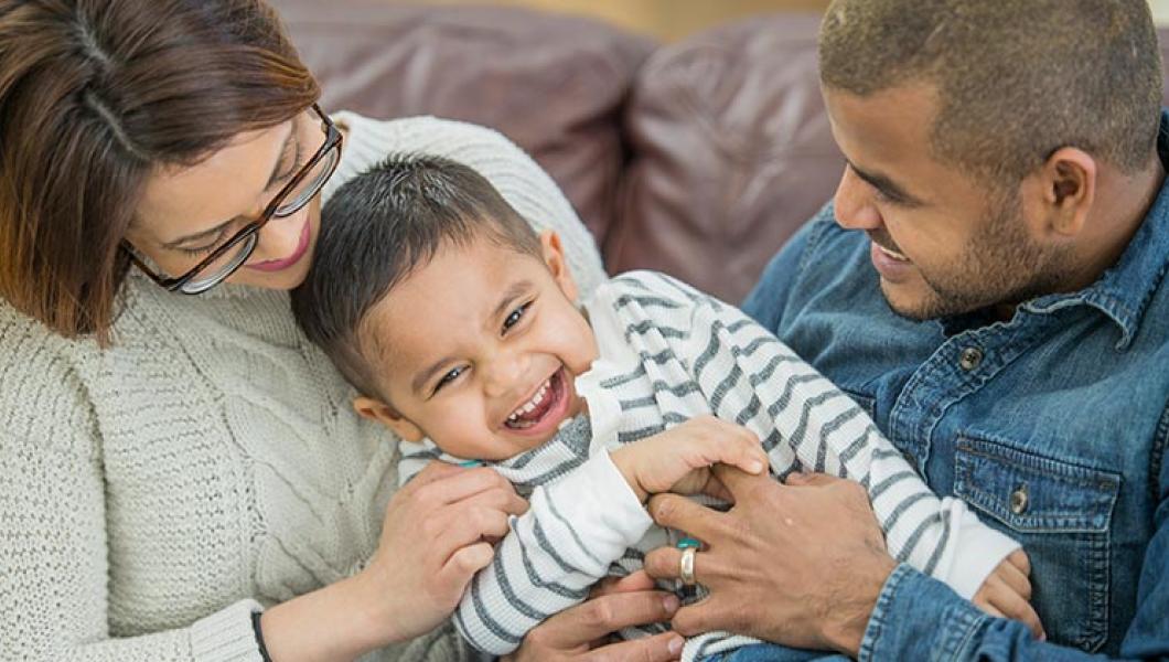 Mother and Father playing with son