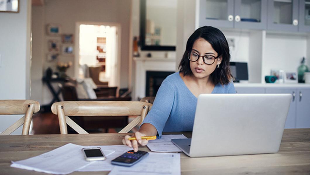 Woman budgeting at laptop