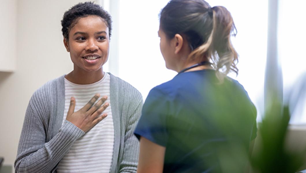 Woman talking to nurse