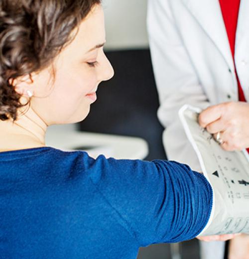 woman getting blood pressure checked