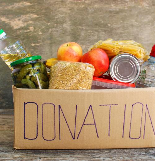 box full of food items labeled for donation