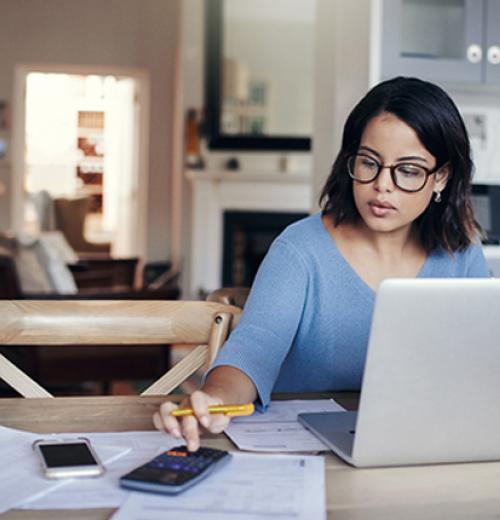 Woman budgeting at laptop