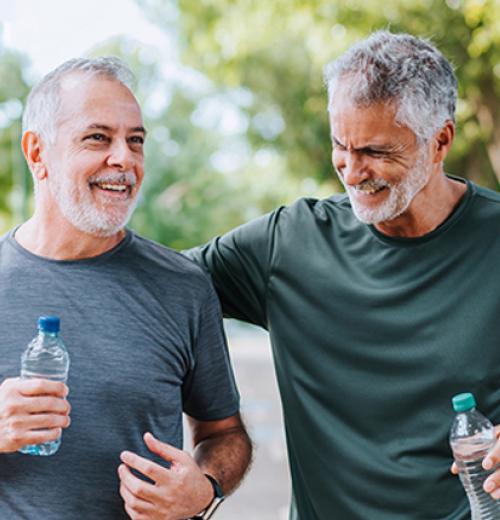 Two middle aged men walking