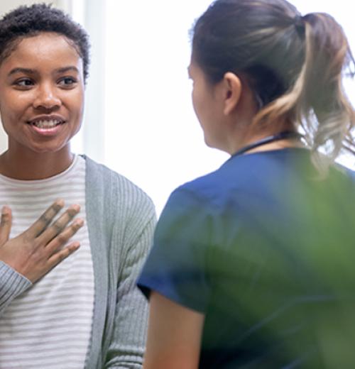 Woman talking to nurse